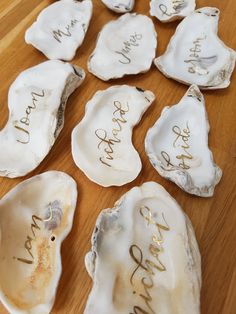 several oysters with writing on them sitting on a table