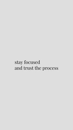 the words stay focused and trust the process are written in black on a gray background