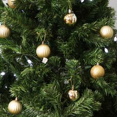 a christmas tree with ornaments hanging from it