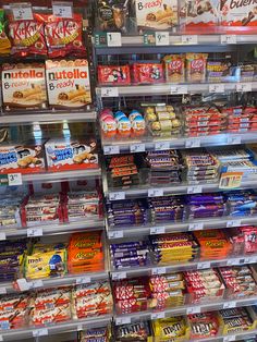 a store filled with lots of different types of food and drinks on shelves next to each other