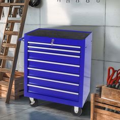 a blue tool box sitting next to a ladder