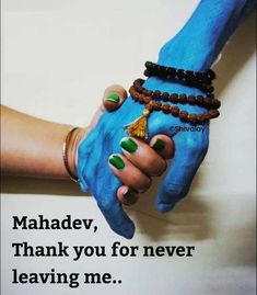 two people holding hands with blue and green paint on their hands, the words mandev thank you for never leaving me