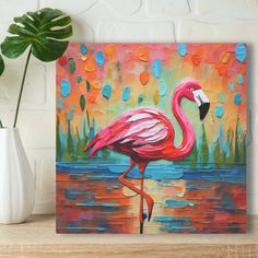 a painting of a pink flamingo standing in the water