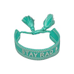 the stay rad wristband with tassels is shown on a white background