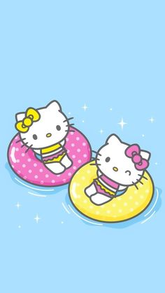 two hello kitty floating on inflatables with one cat wearing a yellow bow