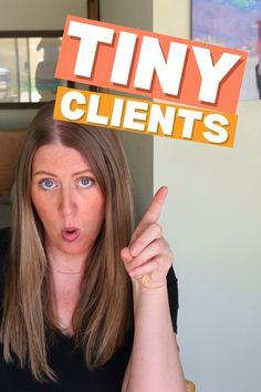 a woman holding up a sign with the word tiny client on it's forehead