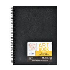 the art book is black and has a yellow stamp on it's cover, which reads