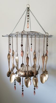 a chandelier with spoons hanging from it