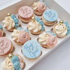 a box filled with lots of cupcakes on top of a white countertop