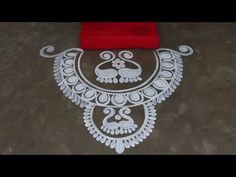 an intricate design on the floor with red cloth