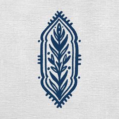 a blue and white pattern on fabric with an oval design in the center, surrounded by leaves