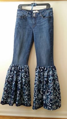 "Redesigned Bell Bottom Jeans, size 10 I redesigned a pair of Levis Jeans by removing the bottom portion of the legs and adding a 19\" length ruffle of Blue Floral Print Gauze Fabric. This pair of jeans is a light weight, dark stretch denim. All of the reconstructed denim items I make are one-of-a-kind! Jeans - 99% Cotton, 1% Elatane Gauze - 100% Cotton Size on tag: Levis, Size 10 Waist 32 in Inseam 34 in Rise 10 in Length/Outseam 43 in  Width of the bottom ruffle is 29 in across while laying on flat surface Measurement across waistband while flat is 16 inches This garment has been prewashed. Wash on delicate cycle. Please contact me if you do not see the size you need in the style you want. I am happy to discuss any custom order options.  Thank you for your interest in my work and for bro Reconstructed Denim, Recyceltes Denim, Birthday Outfit For Women, Blue Jeans Crafts, Boho Jeans, Artsy Outfit, Bottom Jeans, Crazy 8, Bell Bottom Pants