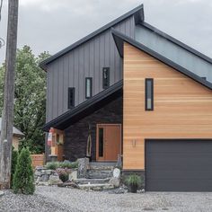 a large house with two garages in the front and one on the other side