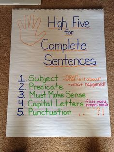 a poster on the floor that says high five for complete sentences