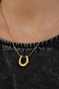 Add some good luck to your outfit with our Horseshoe Necklace in Gold! This playful necklace features a gold horseshoe pendant, perfect for any fashion lover. Horseshoe Necklace-Gold, boutique clothing, casual, the perfect top! Boutique Clothing Horseshoe Necklace Gold, Gold Boutique, Clogs Heels, Body Sock, Horseshoe Pendant, Horseshoe Necklace, Heel Accessories, Clothing Casual, Swim Shoes