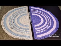 two crocheted rugs sitting on the floor next to each other