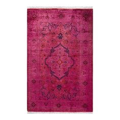 a pink rug with an ornate design on the front and back side, in various colors