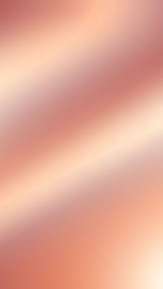 a blurry image of an orange and pink background