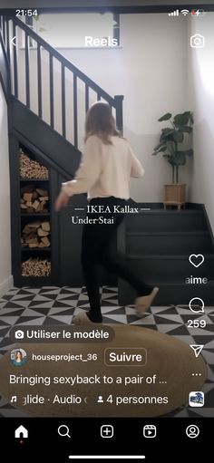 a woman is walking up the stairs in her house with text above it that reads,'i like kahls under sta '