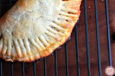 a pie sitting on top of a metal rack