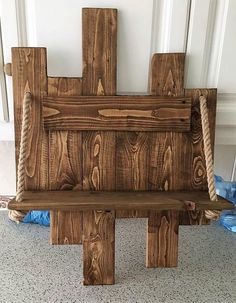 a bench made out of wooden planks and rope