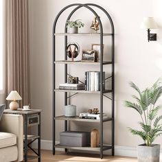 a living room filled with furniture and a book shelf