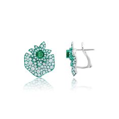 Sculptural botanical shapes indicative of Graziela's home country of Brazil. Gemstone: .85 Carats of Emeralds, 2.25 Carats of G-H Color White Diamonds Metal: 18K Gold Green Rhodium, 7.5 Grams Colors: White Gold, Green Rhodium Measurements: 3/4" X 3/4" Finishing: Omega & Post Back Luxury Green Gemstone Earrings, Fine Jewelry Green Diamond Earrings, Luxury Green Sterling Silver Earrings, Luxurious Green Sterling Silver Earrings, Luxury Green Clip-on Jewelry, Green Clip-on Earrings Fine Jewelry, Luxury Green Emerald Earrings, Luxury Green Earrings For May Birthstone, Earrings 2024