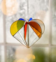 a colorful ornament hanging from a window