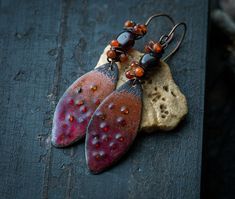 Orange earrings Red earrings Enamel jewelry Glass enamel earrings Textured dangle earrings Garnet and carnelian OOAK Gift earrings * made of copper, vitreous enamel, glass, garnet and carnelian * 100% handmade, artisan earrings * ear hooks are made of a mix of copper and stainless steel * earrings length (with ear hooks): 6,5 cm (2.56")  my Instagram: @annablackiejewelry Handmade Red Enamel Jewelry, Artisan Rust-colored Earrings As Gift, Rust Teardrop Handmade Jewelry, Handmade Enamel Dangle Jewelry, Handmade Enamel Teardrop Jewelry, Bohemian Enamel Pierced Jewelry, Rust-colored Earrings For Gift, Handmade Rust Earrings For Gift, Bohemian Enamel Jewelry