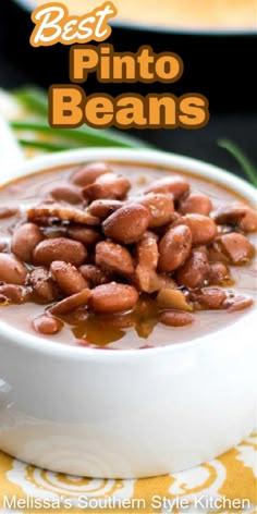 a white bowl filled with beans sitting on top of a table