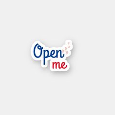 an open me sticker on a white background