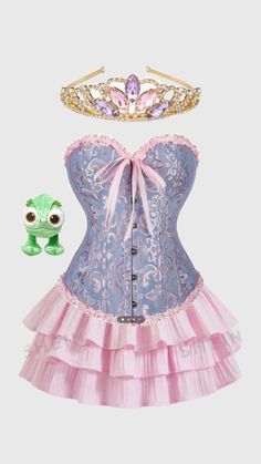 a pink corset with a tiara on top and a green frog toy