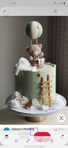 a teddy bear on top of a cake with clouds and stars in the air above it