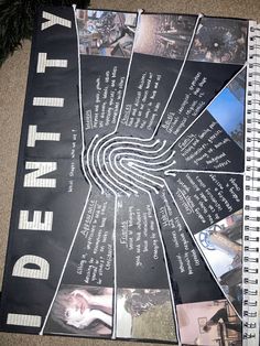 an open spiral notebook with pictures and words on the cover, sitting on carpeted floor