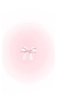 a white bow on a pink background