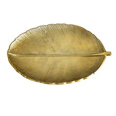 a gold plate with a leaf on it