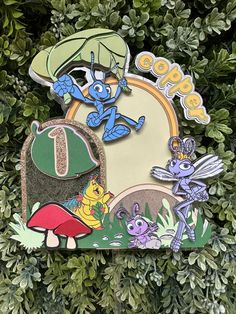 the cartoon characters are on top of each other in front of some green plants and bushes