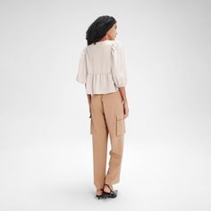 Featuring a versatile front tie that can be styled into a bow or draped for various looks, this blouse boasts mid-length puff sleeves and a flowy peplum hem for a feminine touch. Made from lightweight, soft fabric, it offers a relaxed fit that's ideal for pairing with jeans, skirts, or shorts. Perfect for any occasion, from casual outings to more polished events. A New Day™: Style that goes wherever you do. Casual Beige Blouse With Balloon Sleeves, Spring Workwear Blouse With 3/4 Sleeves, Spring Puff Sleeve Blouse With Tie Sleeves, Cropped Blouse With Gathered Sleeves For Fall, Casual Blouse With Puff Tie Sleeves, Relaxed Fit Blouse With Gathered Sleeves For Day Out, Short Sleeve Puff Top For Daywear In Fall, Spring Workwear Puff Sleeve Balloon Top, Chic Spring Puff Sleeve Top With Tie Sleeves