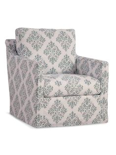 an upholstered chair with a blue and white floral pattern on the armrests