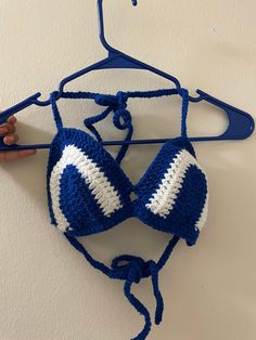 Looking for a versatile and comfortable bikini top? Look no further than this crochet blue and white top! Perfect for any season, this cozy top is pool-safe and ready for any adventure. The beautiful blue and white design is sure to turn heads, while the moisture-wicking fabric keeps you cool and comfortable in the heat. With its classic style and durable construction, this bikini top is a must-have for any swimwear collection. So why wait? Grab your crochet top today and get ready to hit the water in style! Blue And White Top, Blue And White Design, Blue White Top, Cozy Tops, Your Crochet, Swimwear Collection, Crochet Fashion, White Design, Moisture Wicking Fabric