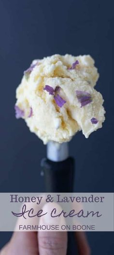 honey and lavender ice cream on a stick in front of a dark background with text overlay that reads, honey & lavender ice cream farmhouse on bone