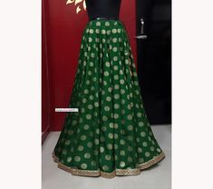 Made to Order/Made to Measurement/Custom Made Indian Lehenga Skirt (PLEASE NOTE THIS IS SKIRT ONLY) - Fabric: Brocade Silk - Color : Green - Fully Flared Kalidaar (Paneled) Skirt - Lined - Gold Sequins Border - Drawstring with beautiful  gold latkan - No can can This is Made To Order and we require following measurements in inches. 1. Waist of Skirt 2. Length of Skirt PLEASE NOTE: BUYERS ARE RESPONSIBLE FOR ANY CUSTOMS AND IMPORT TAXES THAT MAY APPLY. Fabric Care : Dry Clean Only Disclaimer: The Elegant Green Festive Skirt, Traditional Green Skirt Set For Party, Traditional Green Skirt Set For Wedding, Festive Flowy Skirt For Wedding, Festive Flowy Wedding Skirt, Festive Wedding Skirt, Traditional Long Skirt With Zari Work, Long Skirt With Pallu For Reception, Festive Long Skirt With Pallu