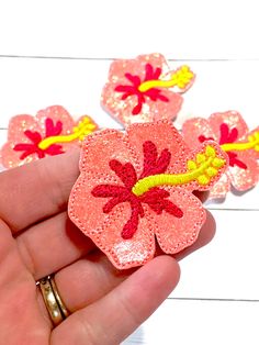 Glitter CORAL HIBISCUS FLOWER Embroidered Feltie. These are perfect for many different crafts! Use them for Feltie Bookmarks, Hair Bow Centers, Badge Reels, Planner Accessories, Magnet or Cork Boards, Cupcake Toppers, Embellishments for Frames or Cards, Scrapbooking, Party Favors, Pencil Toppers, Pacifier Clips, or many other craft projects! This listing is for: **Glitter CORAL HIBISCUS FLOWER Feltie Embellishments. ** Vinyl front color is NEON CORAL GLITTER & back felt color is CORAL . ** C Felt Hawaiian Flowers Diy, Felt Hibiscus Flower, Hibiscus Flower Keychain, Orange Flower-shaped Beach Jewelry, Hibiscus Flower Hair Clip, Beach Beads, Coral Hibiscus, Coral Flower, Hawaiian Christmas