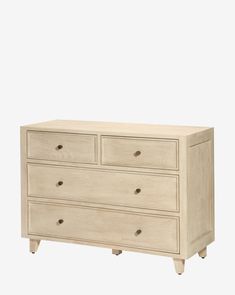 a white dresser with four drawers and two doors