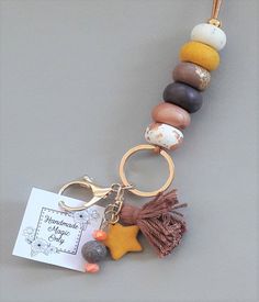 a keychain with a star charm hanging from it's side