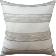 a gray and white striped pillow on a white background