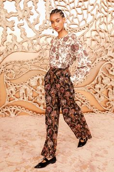 Arriving in soft wool twill, our Esen Blouse is intricately adorned with vivid paisley botanicals based on a classic French floral print. Featuring cream, red, and peach hues, this long-sleeve silhouette is effortless and fits loose in the bodice, highlighting the beauty of the pattern. It has buttoned cuffs and fastens with a back buttoned keyhole. Composition: 50% Wool 50% Viscose Pair with our Valencia Pant, Carved Heart Earring, Kiki Heel to complete the look. Nyc Boutiques, Sleeve Silhouette, Heart Earring, Carved Heart, French Floral, Knitted Coat, Knit Sweatshirt, Signature Print, Swimwear Girls