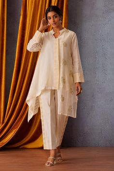 Off white asymmetric shirt featuring side sequin embroidery and tissue detailing on placket and cuffs. Paired with coordinating side tissue stripe pant and inner., Fit: Relaxed Asymmetric Shirt, Shirt Pant, Shirt Pant Set, Sequin Embroidery, Pant Sets, Sequins Embroidery, Pant Set, Striped Pants, Set For Women