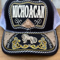 The price already INCLUDES taxes and shipping within the United States!  Black cap from Michoacán with a horse embroidered on the visor. If you are from Michoacán, this cap is for you.  Description of the Handmade Cap  Style: Michoacan Cap with Horse #306  Made in Mexico  Cap with pre-curved visor  Structured cap with high profile fit  Adjustable plastic snap closure  Customers are responsible for any customs fees for international shipments. Please contact your local government agency for these Cap Style, Black Cap, Local Government, A Horse, Abs Workout, Snap Closure, United States, Horses, Black