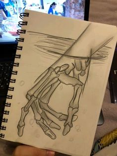 a drawing of a hand holding a knife in front of a laptop computer on a desk